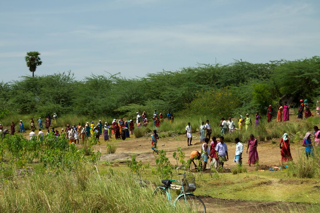 Rural villages digging out a silted-up water tank in their community as part of the Rural National Employment Guarantee Act (NREGA), a scheme where every Indian is guaranteed the right to 100 days paid work in a year for unskilled manual labour.